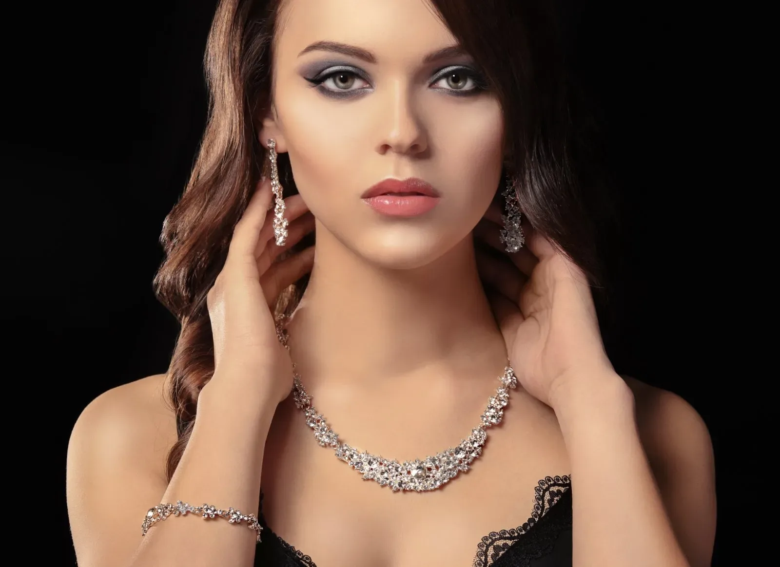 Model wearing fine gold jewelry