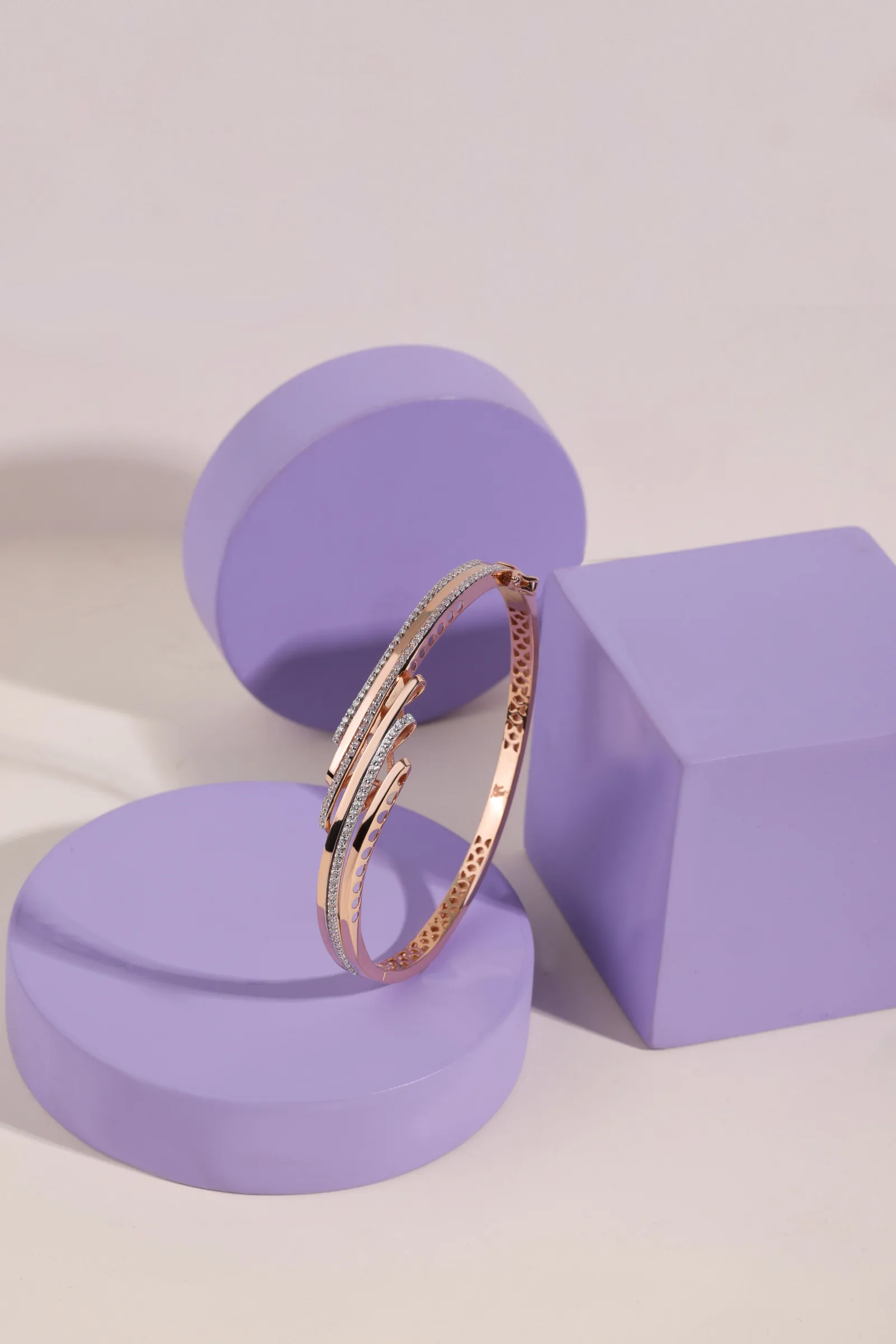 Gold bangles on white